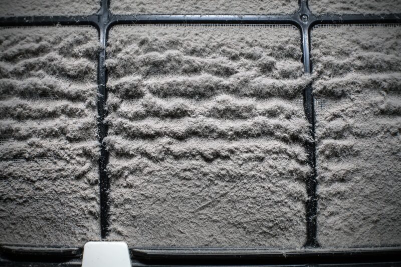 hvac air filter clogged with a thick layer of dust